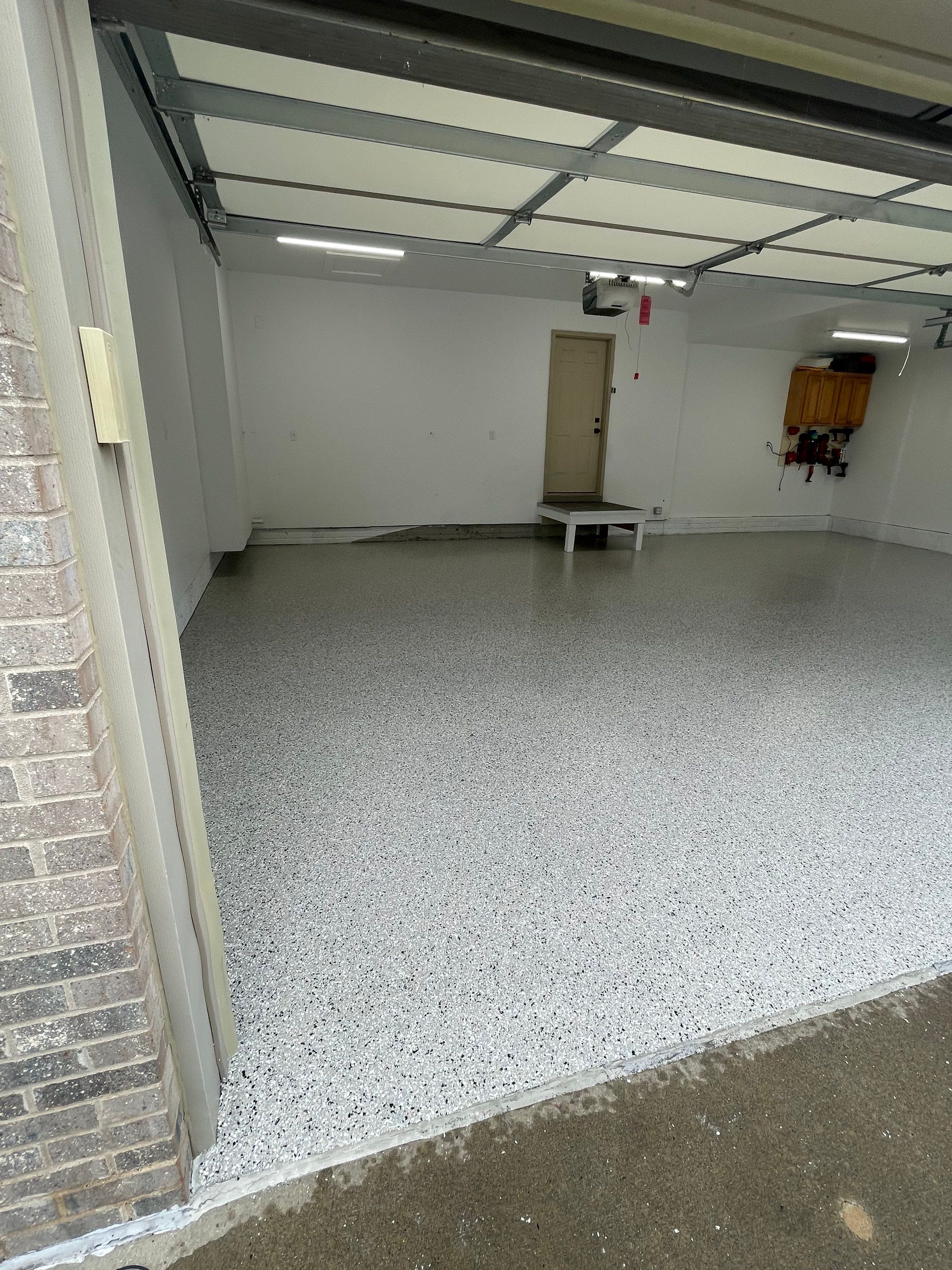 Cabin Fever Garage Floor System in Sioux Falls by Select Painting, Coatings & Garage Cabinets
