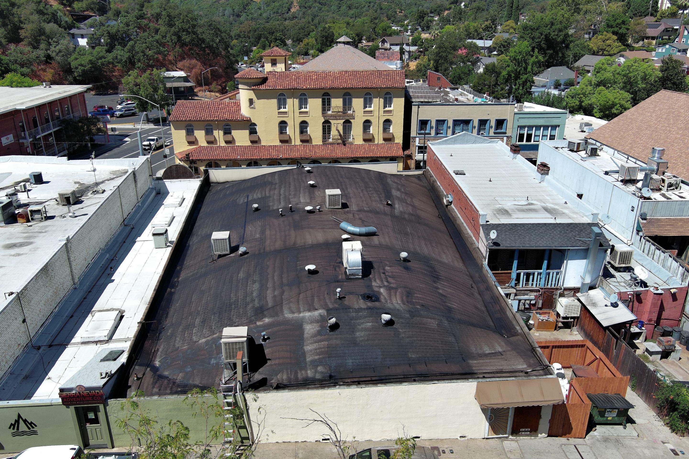 Foam and coatings on commercial roof by Straight Edge Roofing Inc