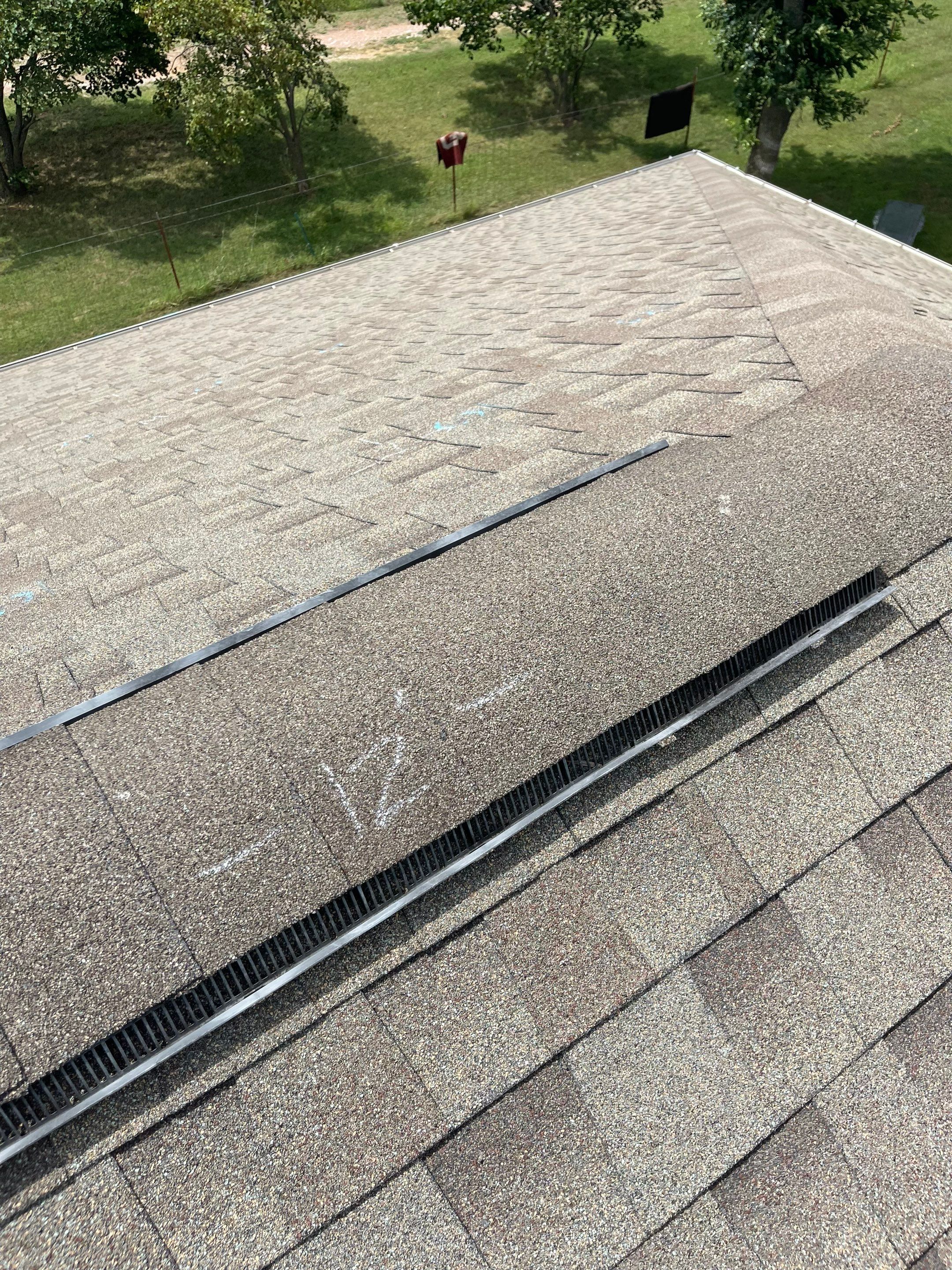 Hail Damage on a Roofing System by Icon Roofing And Construction 