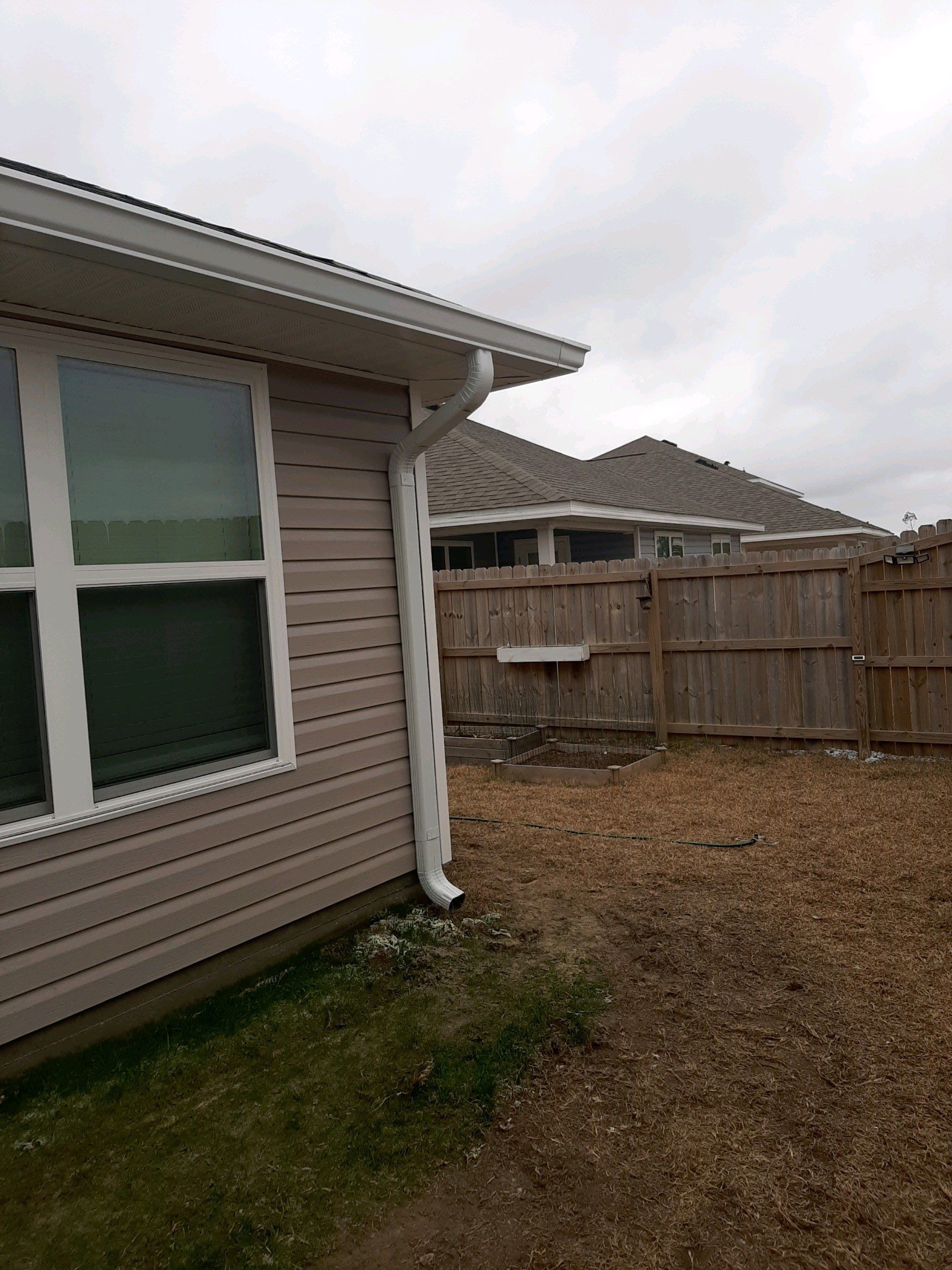 Seamless Gutter Installation Using White 6 Inch Gutters by Gutter Professors