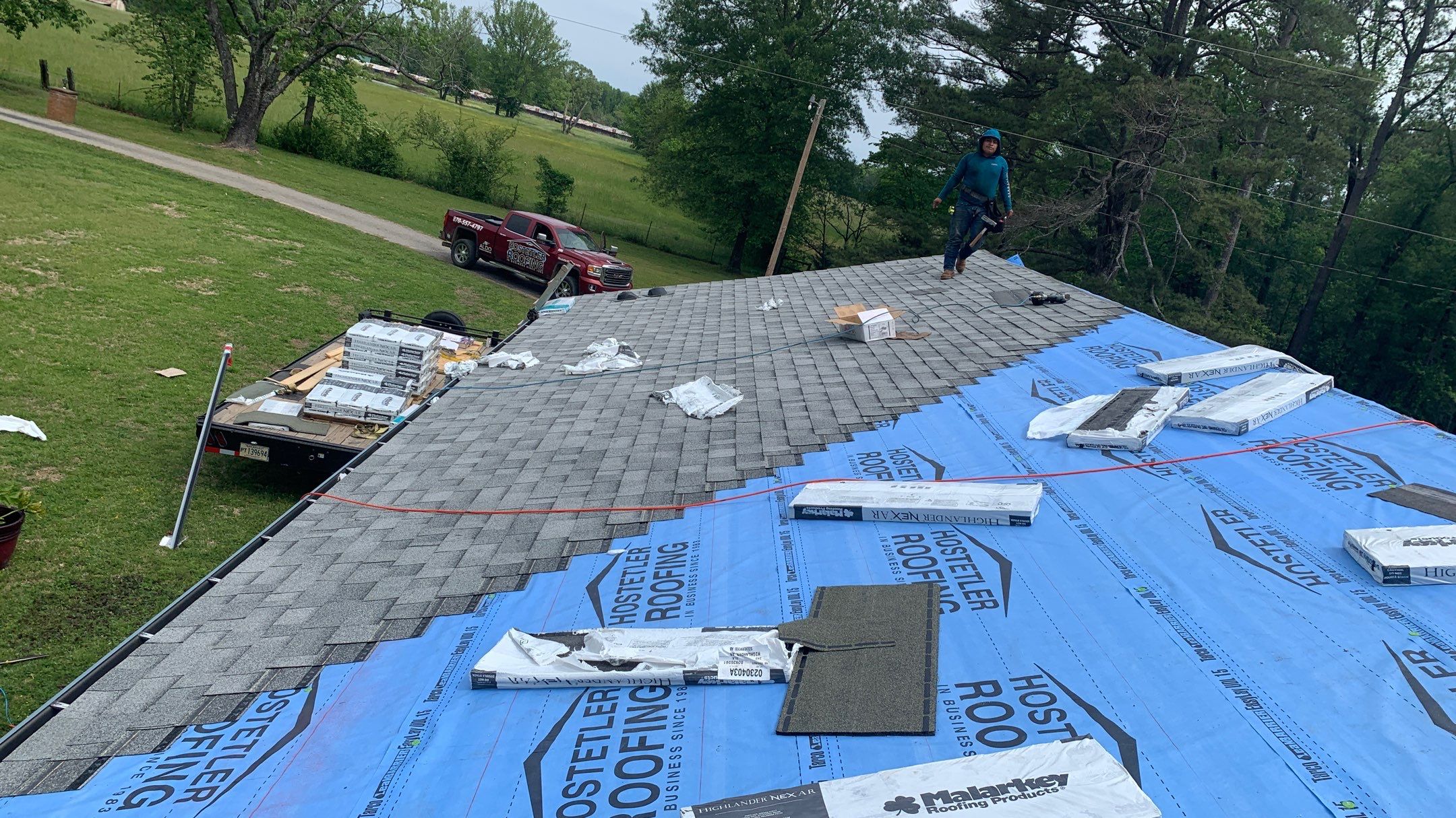 Residential Roofing Installation using 50 mil PVC by Hostetler Roofing