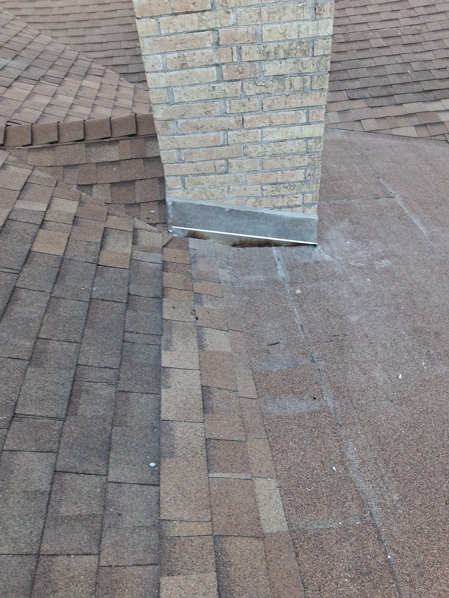 Chimneys need a Cricket.  by Bayfront Roofing and Construction