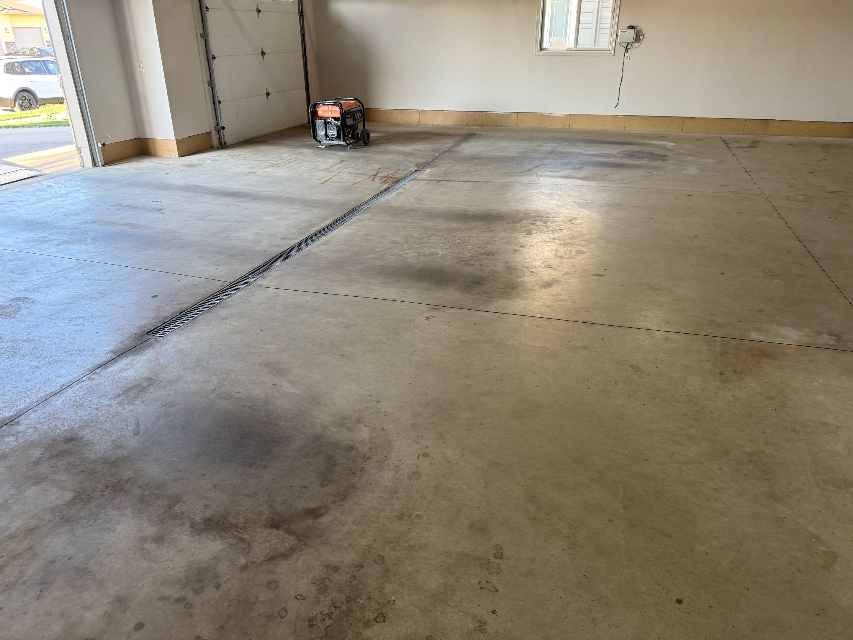 Multi-Car Garage Epoxy Floor Coating in Beresford by Select Painting, Coatings & Garage Cabinets