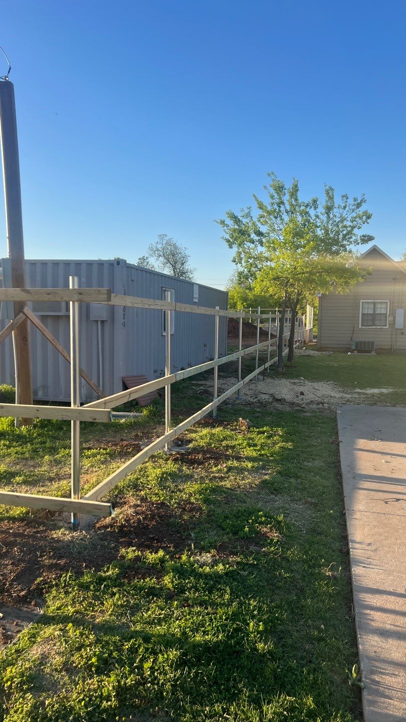 Cedar Fence using Cedar Pickets and Metal Poles by Clays Services Inc