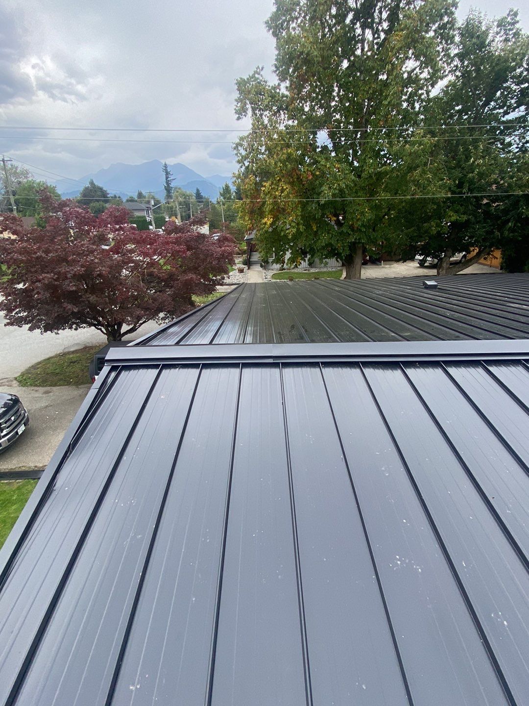 Residential Roofing Installation using 12" Prolok metal  by Top Notch Roofing Inc