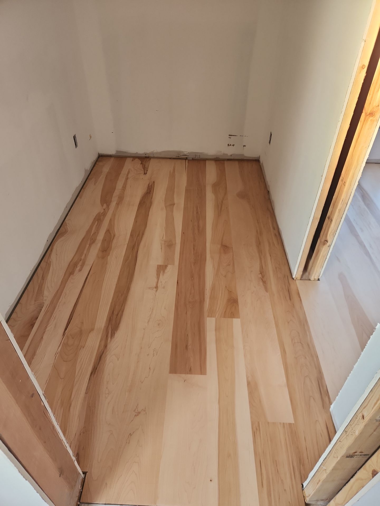 Full glue down Installation over radiant heat 7" Maple character grade by Ann Arbor Hardwoods 