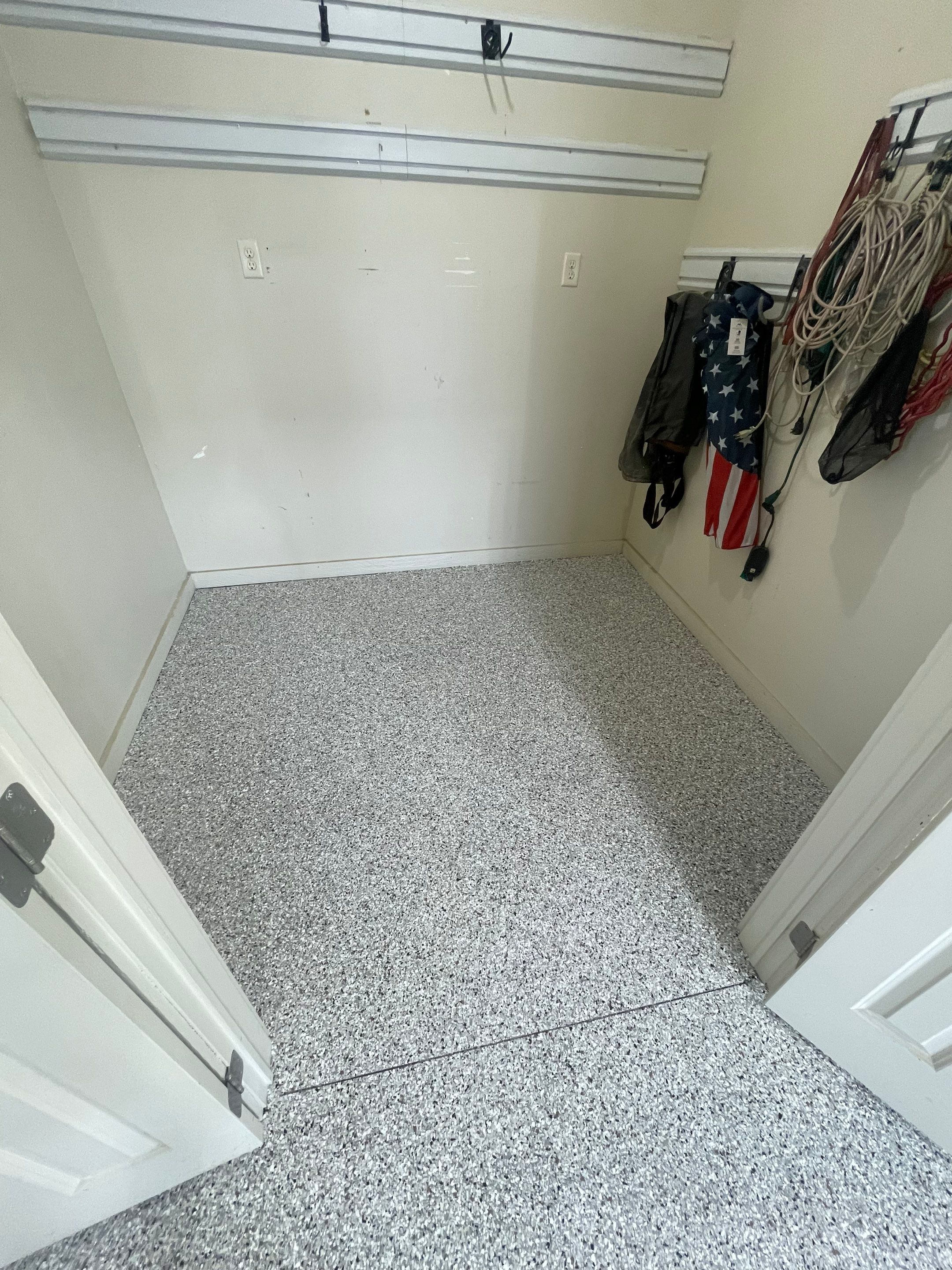 Coyote Flake Garage Floor Coating in Sioux Falls with Trench Drain by Select Painting, Coatings & Garage Cabinets