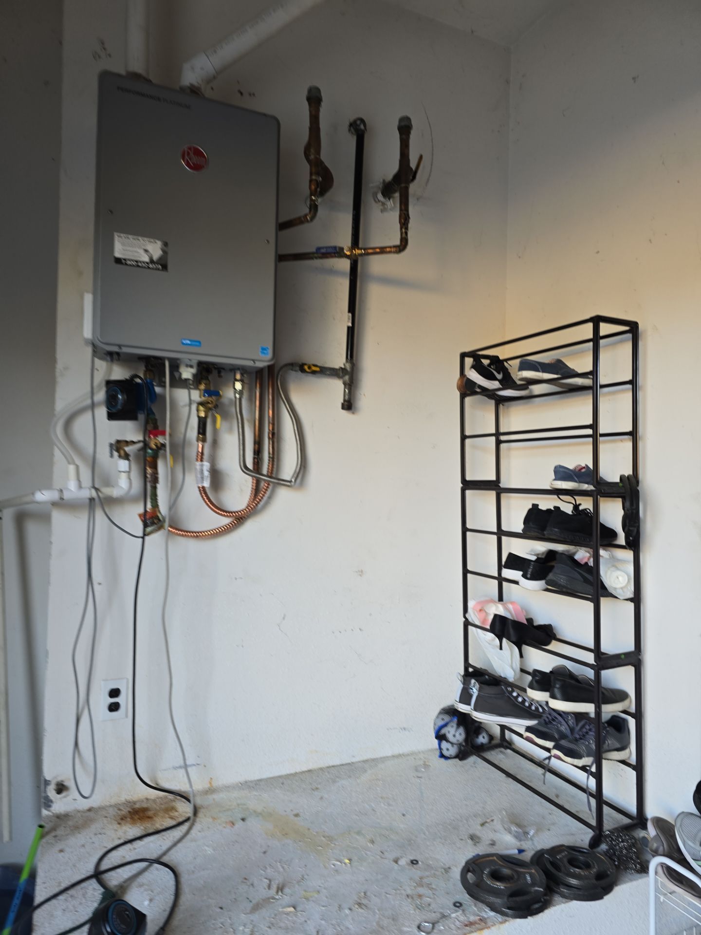 Installing a New Tankless Water Heater by Us Plumbing 