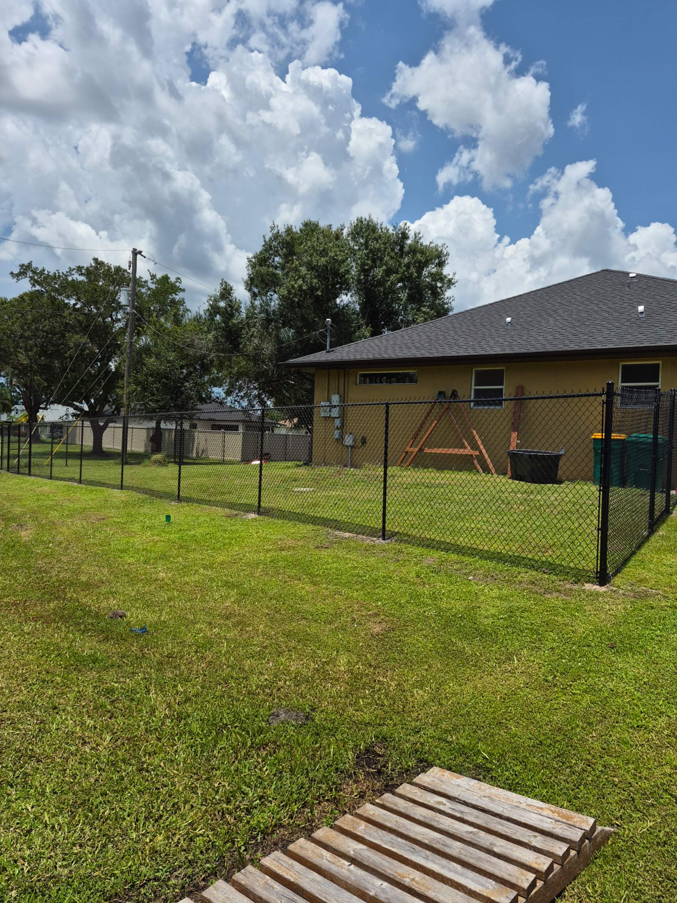 Black Chain Link Perimeter Fencing with Double Gates in Port Charlotte by True Fence LLC
