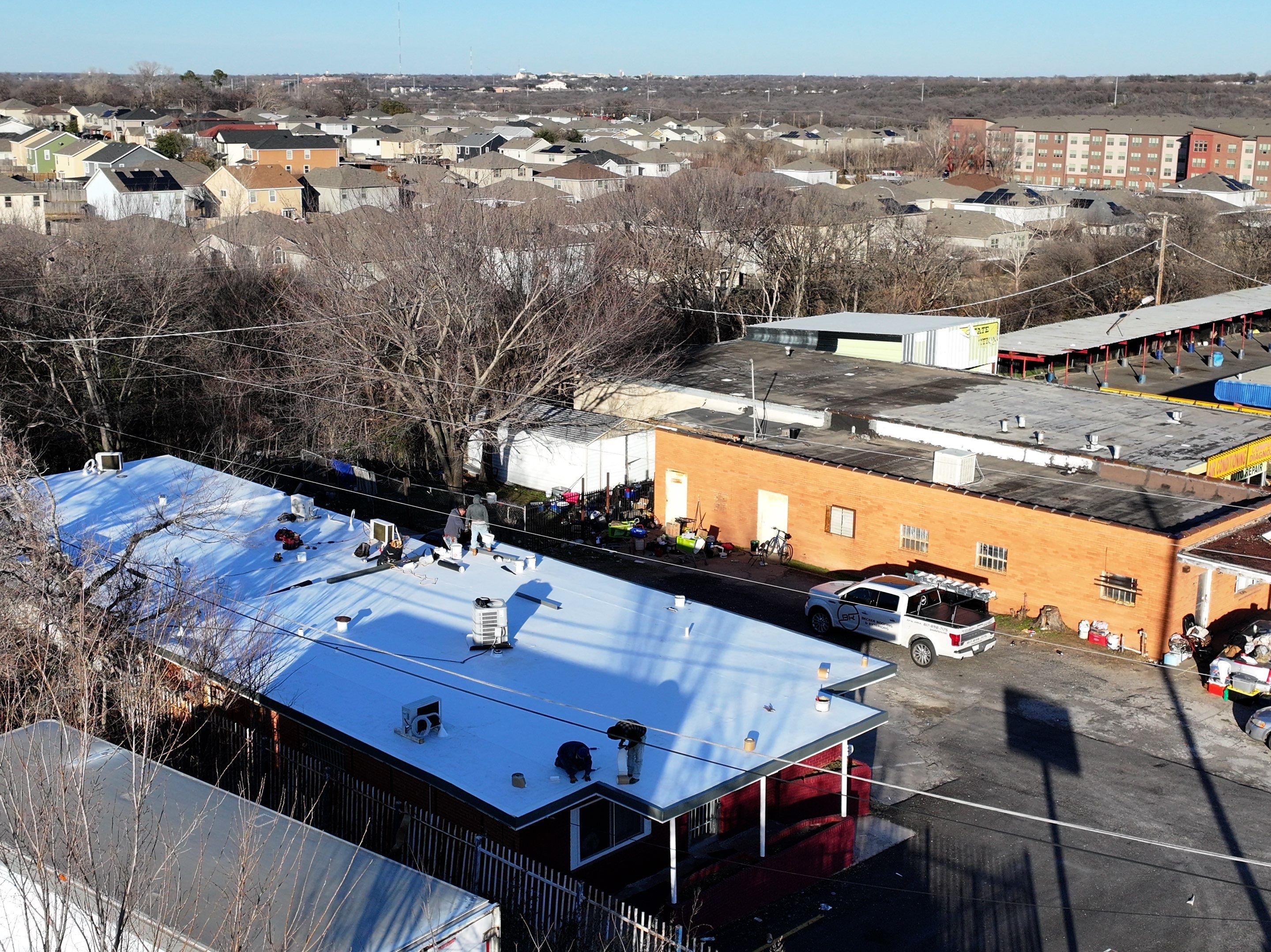 Commercial roofing overlay using GAF TPO over an old ballast roof by Becker Roofing and Exteriors