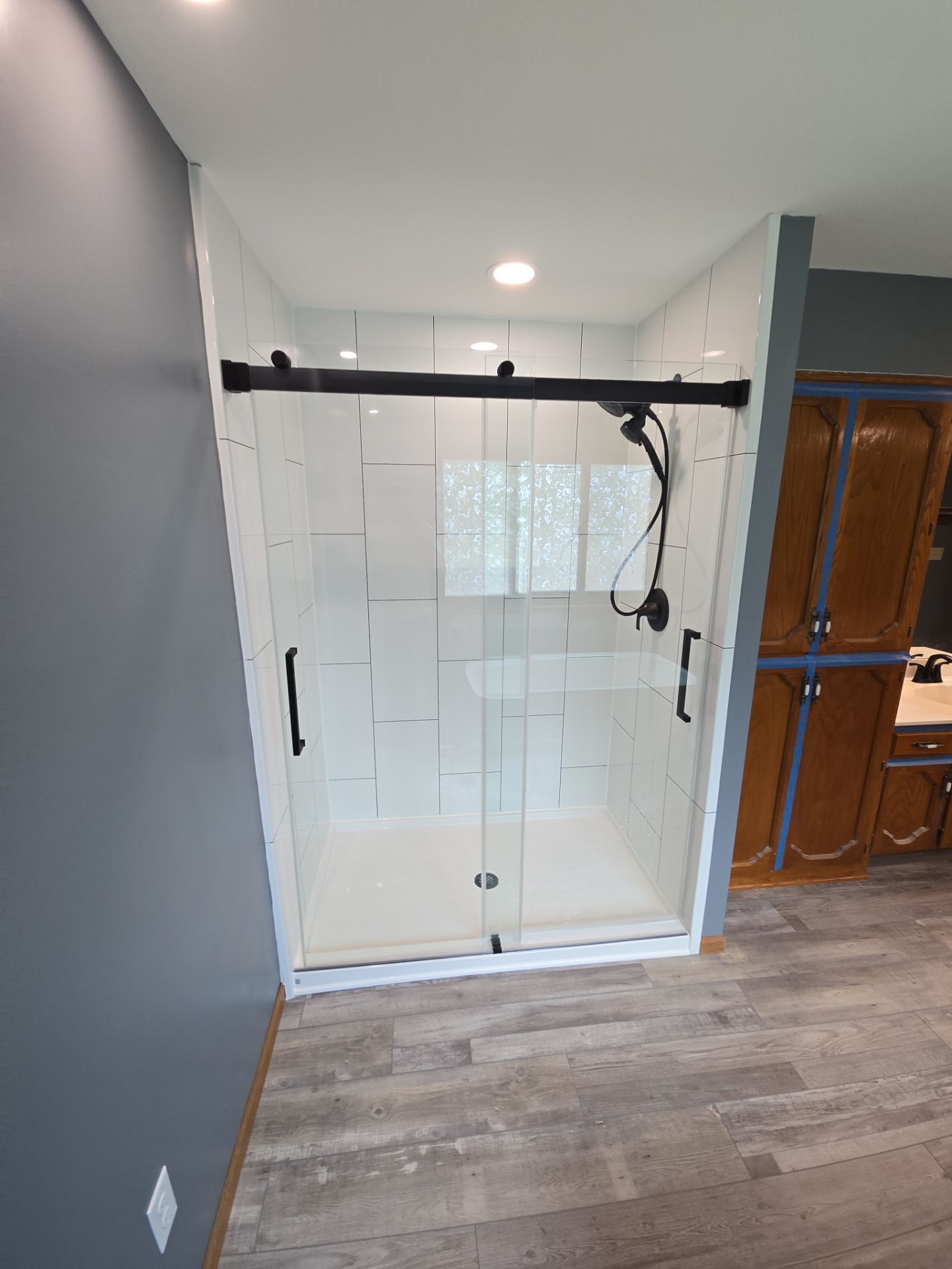 Full bathroom remodel, all new except vanities by The Shower Company
