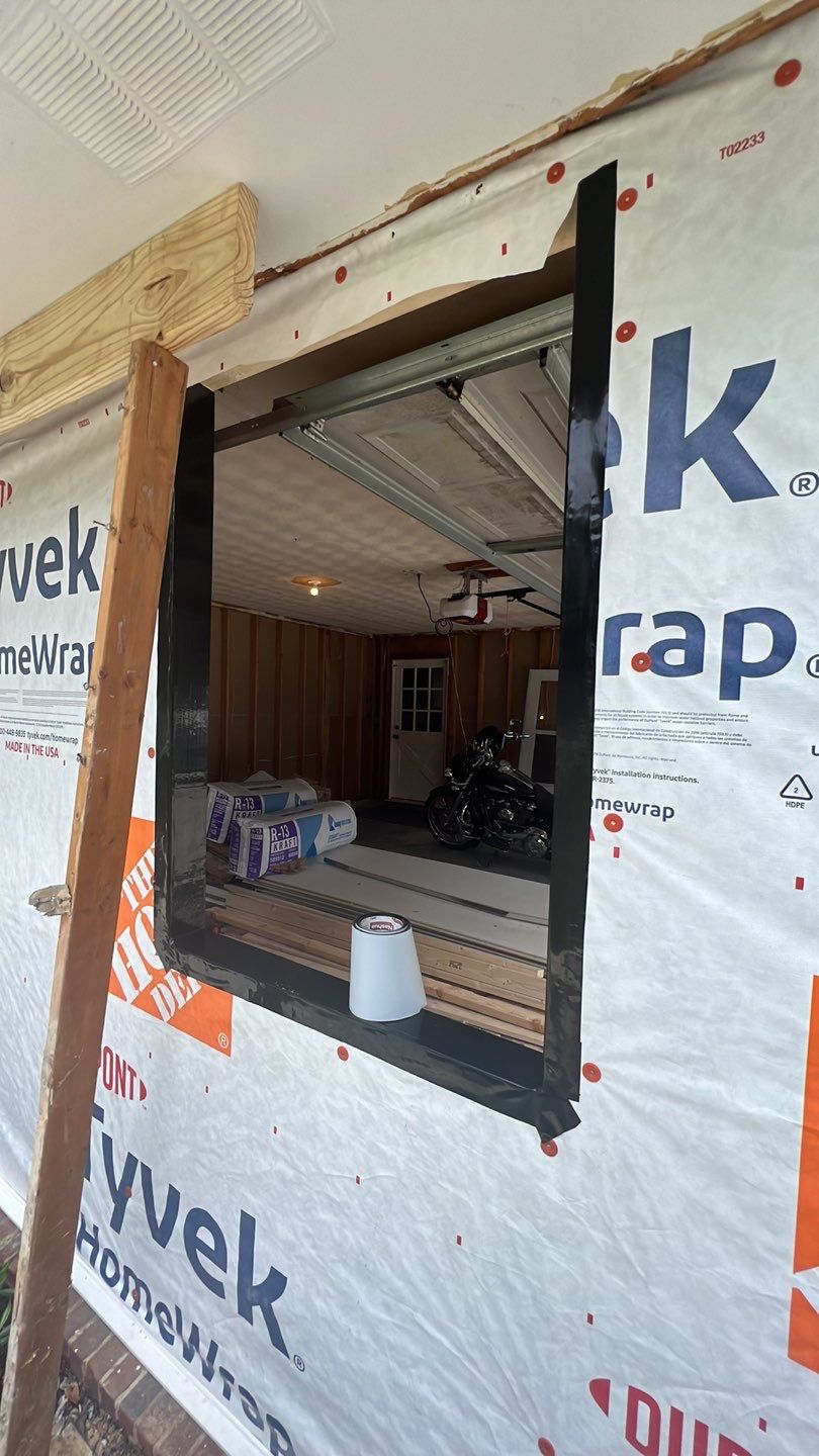 Snellville Garage Remodel Featuring Epoxy Floors and Board and Batten Siding by Swift Home Renovations