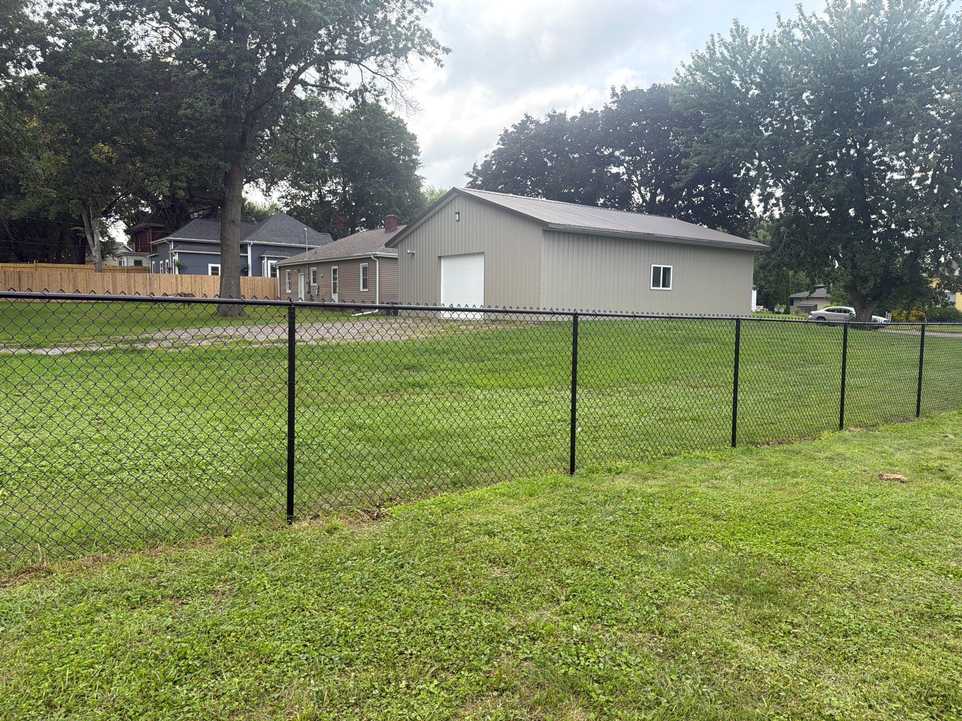 Residential Black Chain Link Fence Installation in Reinbeck by Perfect Picket Fence and Stain