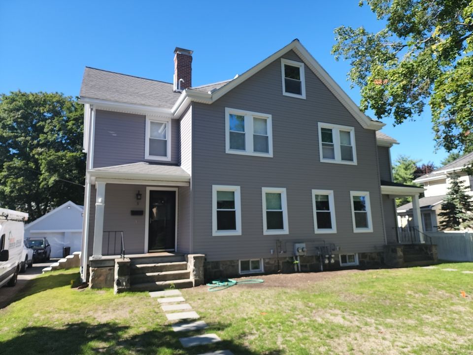 Vinyl siding layover project for 2 family in Wellesley, MA by UBrothers Construction