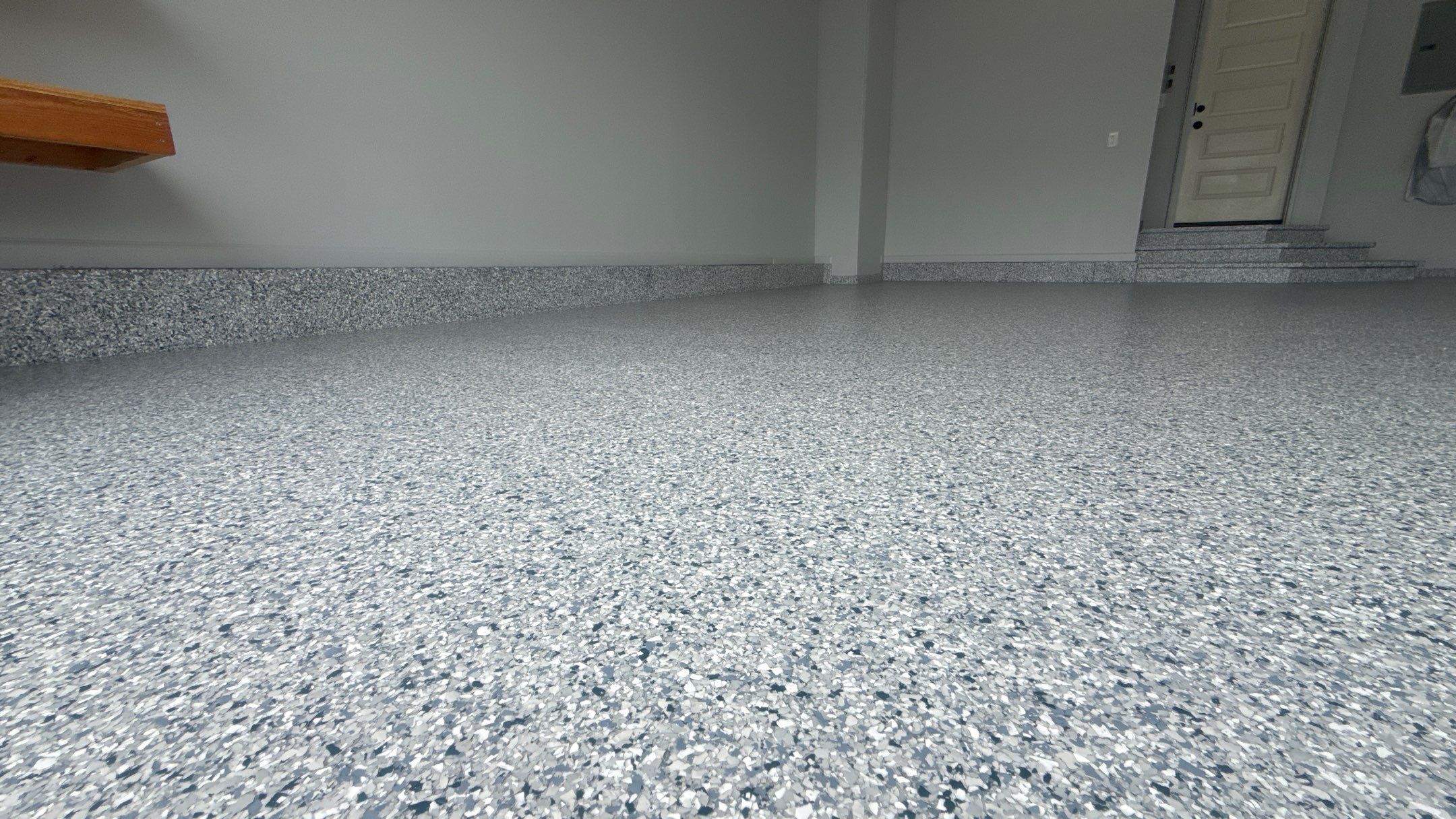 Comprehensive Garage Renovation Featuring Epoxy Flooring and Custom Storage in Shawnee by Banner Garage