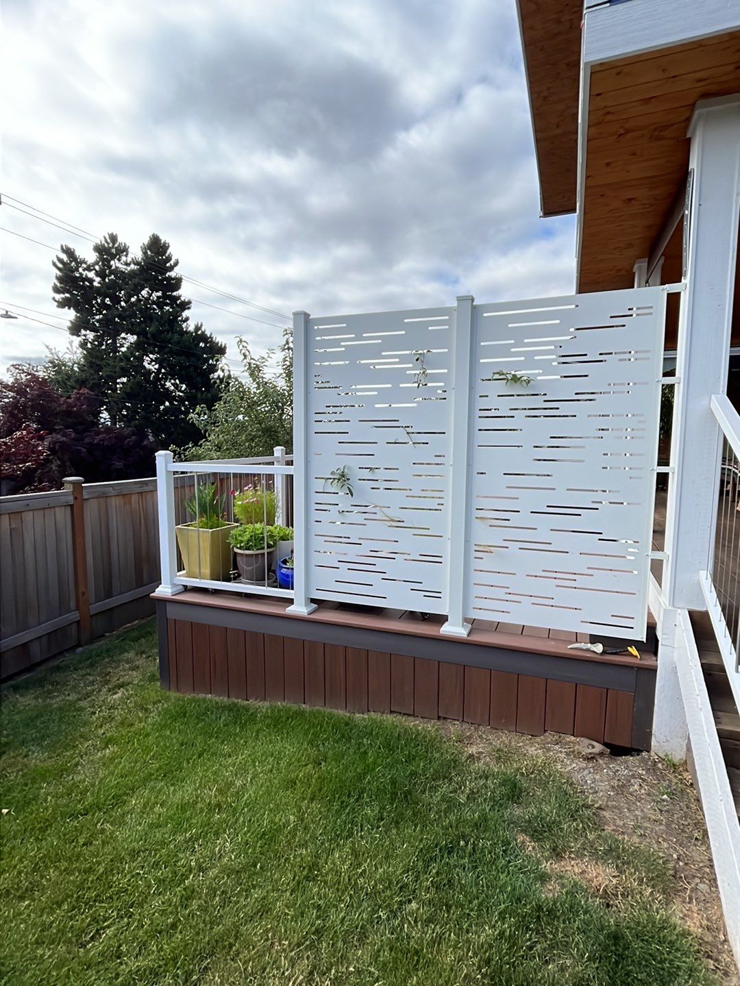 Deck Extension with Hideaway Screen by Alki deck builders 