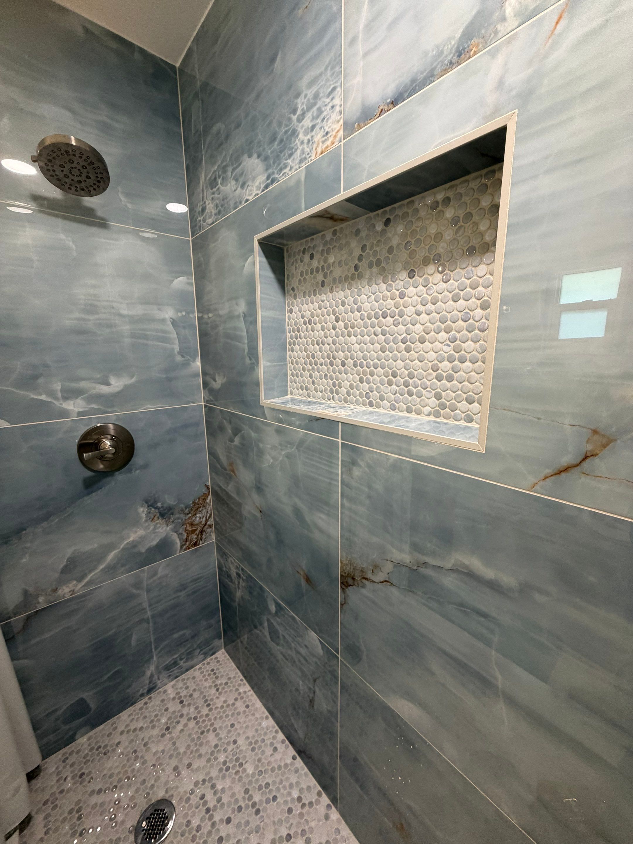Elevated Bathroom Renovation featuring Oceanic Tile in Ormond Beach by Acies Renovations