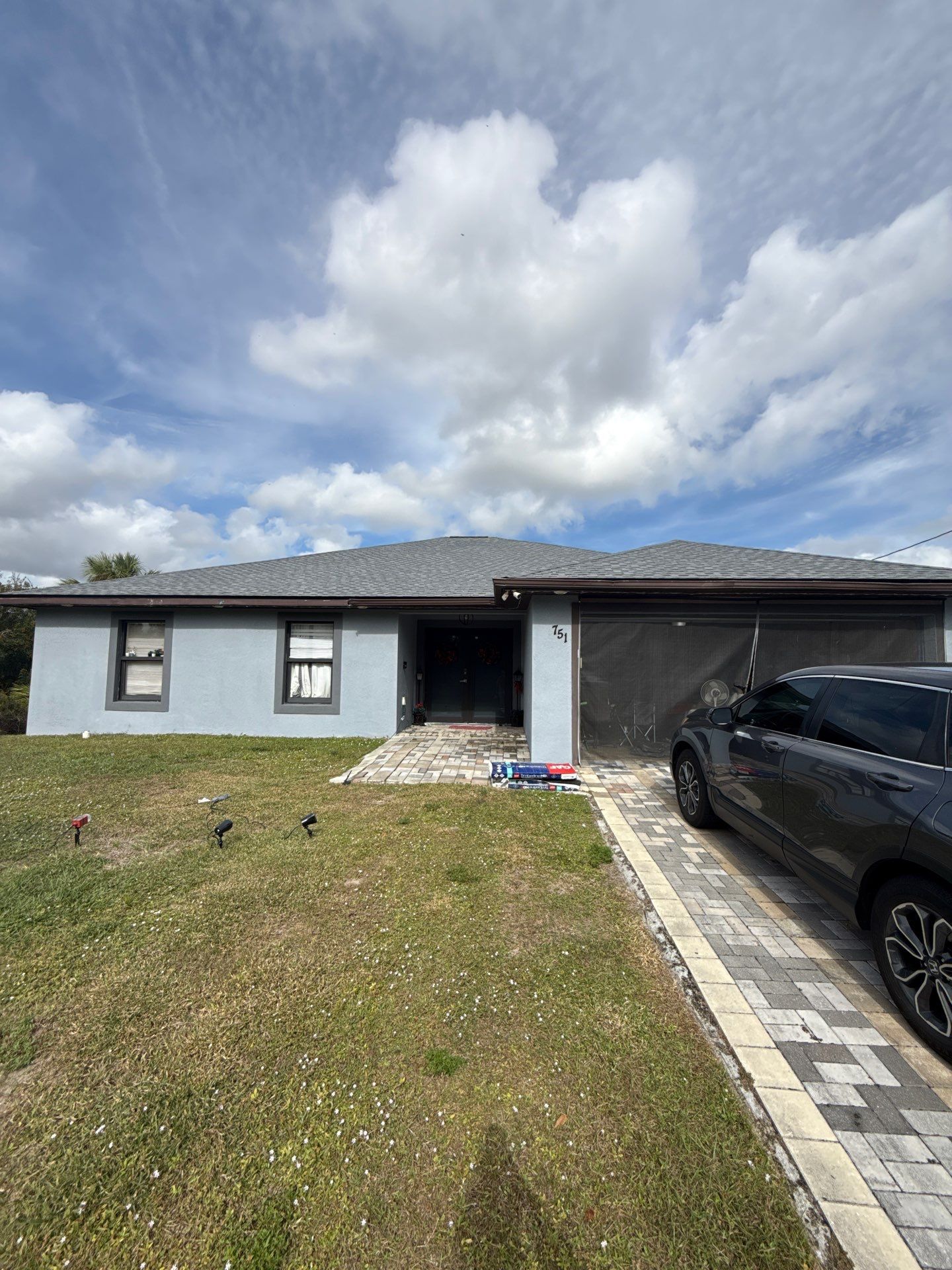 Black Seamless Gutters & Soffit/Fascia in Lehigh Acres FL by Gutter Professors