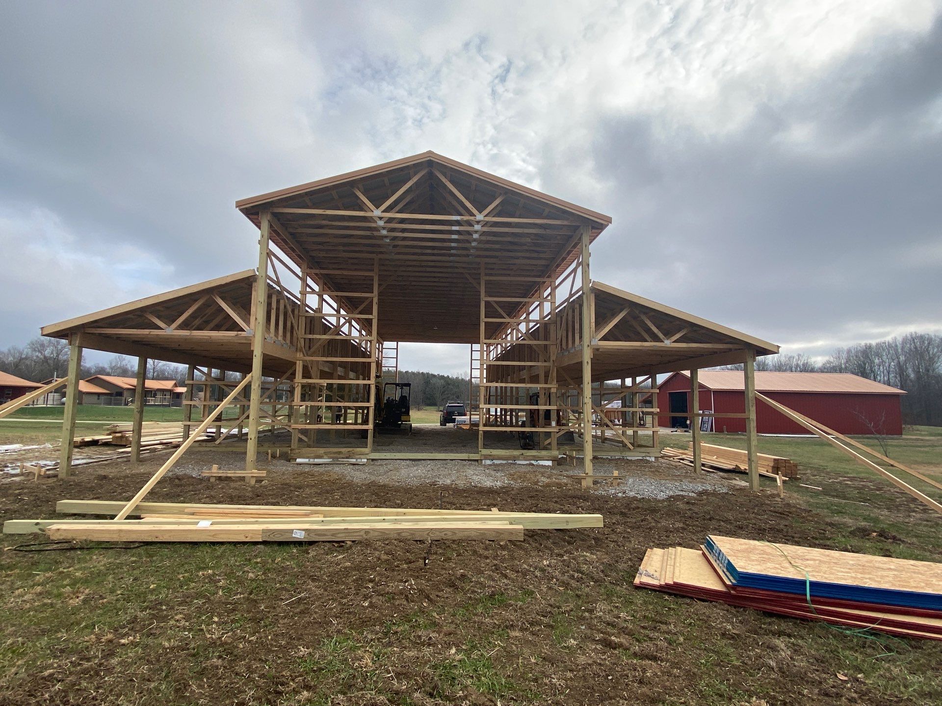 Custom Pole Barn Home with Charcoal Siding and Copper Roof by The Barn Builders