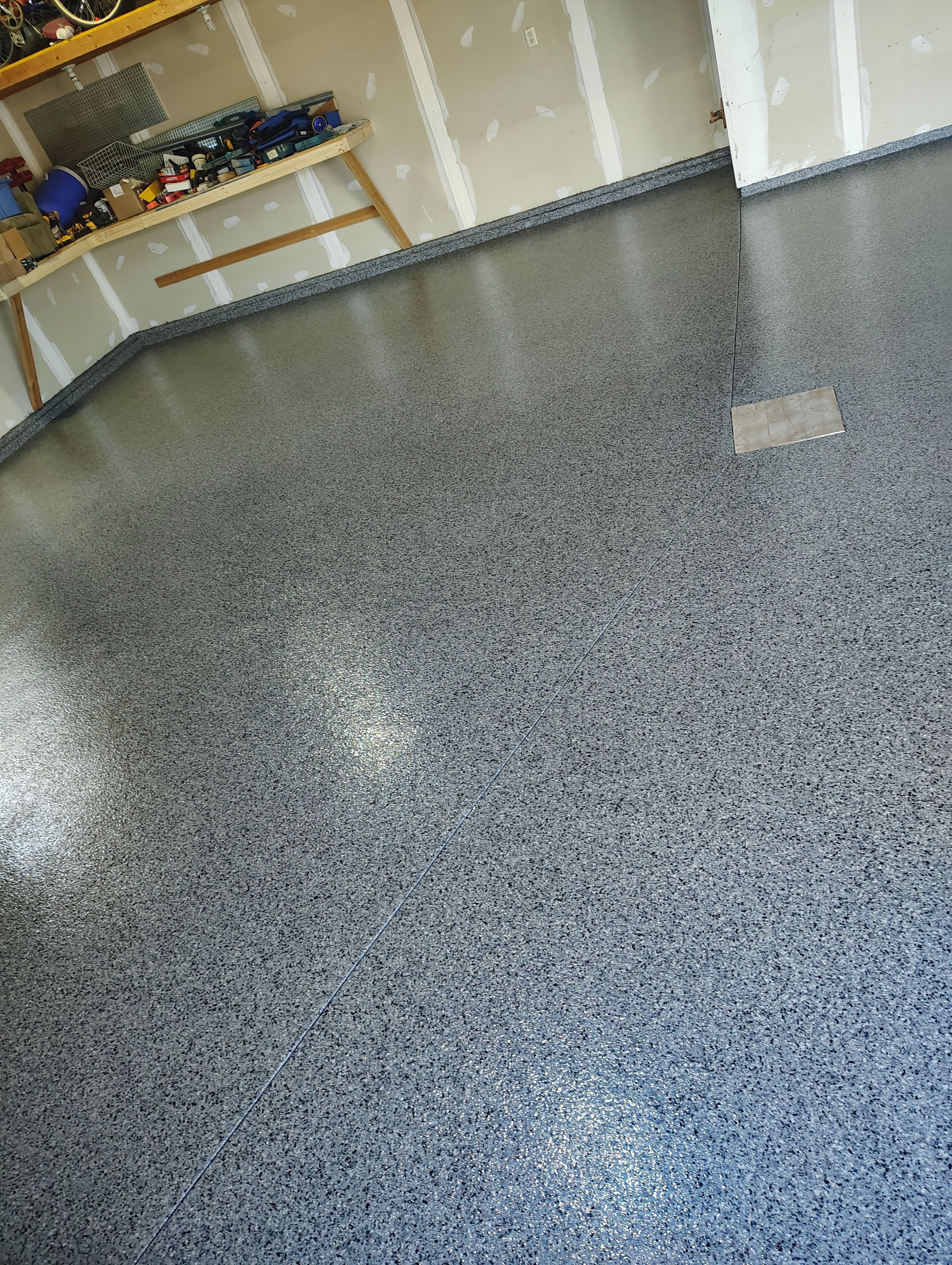 Sioux Falls Garage Concrete Grinding and Nightfall Decorative Chip Coating by Select Painting, Coatings & Garage Cabinets