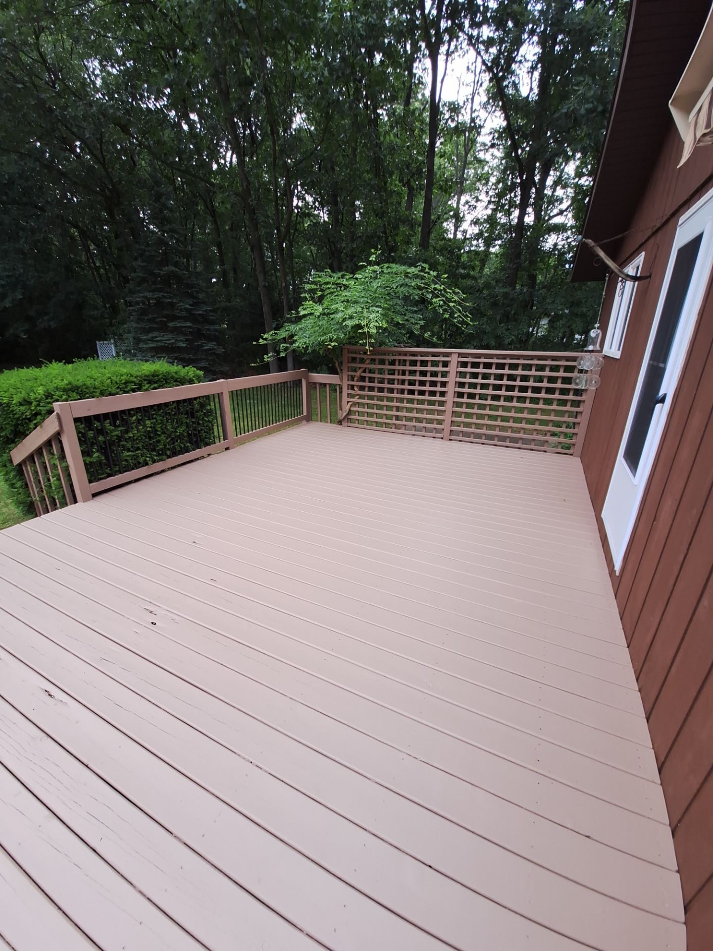 Muskegon Deck Restoration with Pressure Treated Railings and Wood Staining by Gordon Painting
