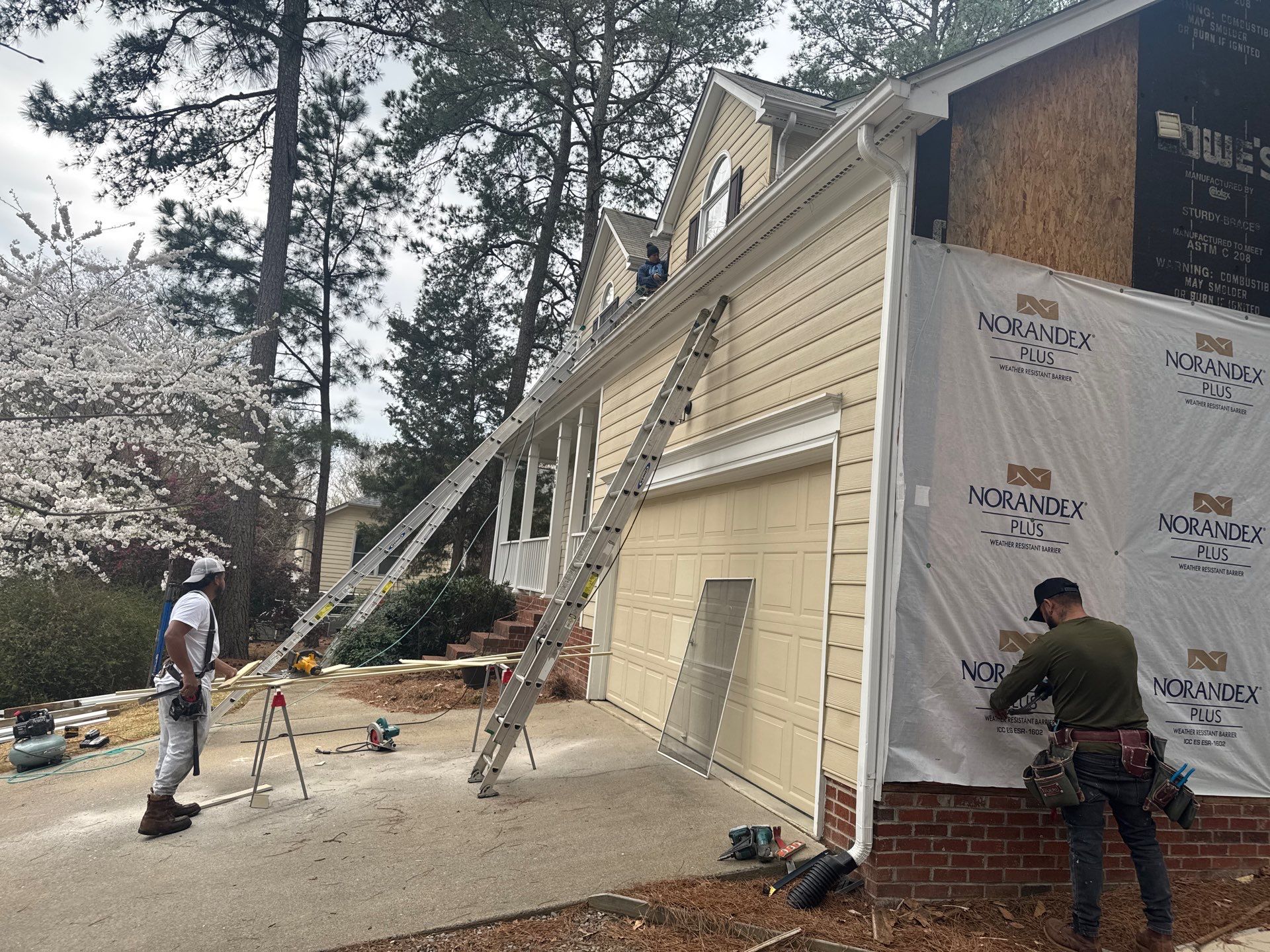 Exterior paint and siding replacement by GonzalezPainters & Contractors Inc 