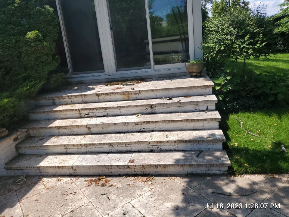 marble patio cleaning and sanding using Polysweep polymeric sand by Northern Power Washing LLC.