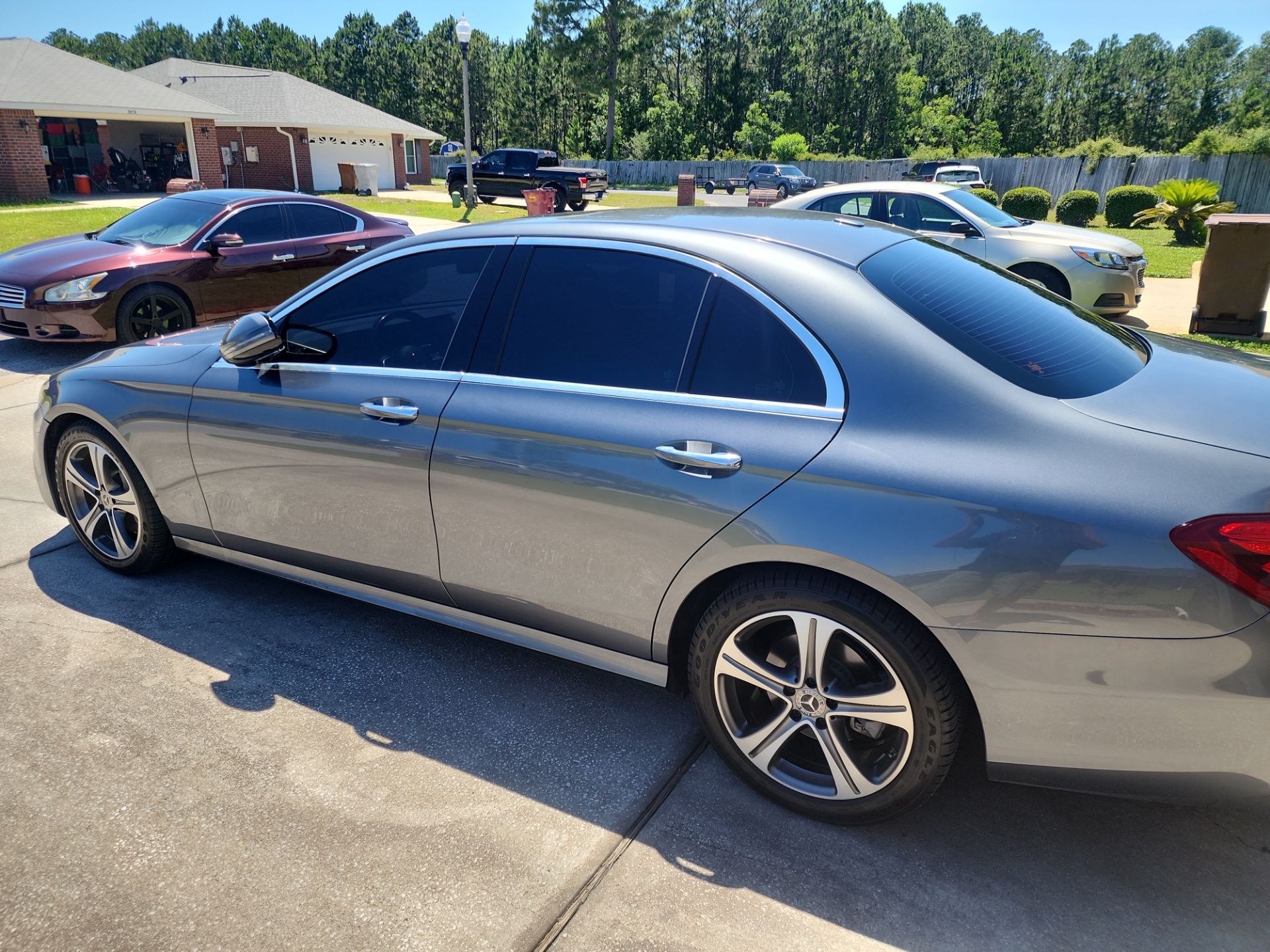 the car appears to have its windows tinted the tint adds privacy and reduces glare and heat from sunlight inside the vehicle the work looks professional with no visible bubbles or peeling edges likely providing uv protection as well