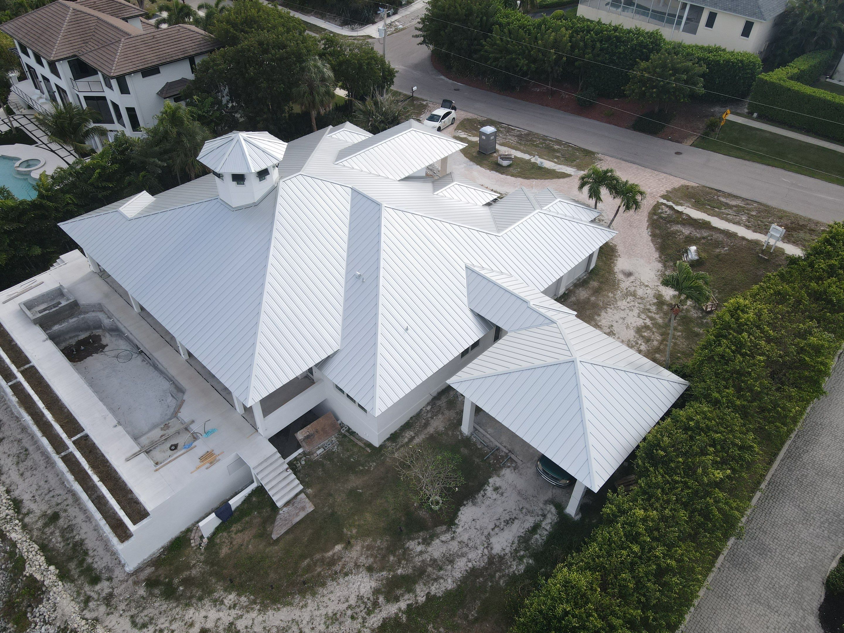 Residential Roofing Installation using Galvalume Standing Seam by Durabilis Roofing INC
