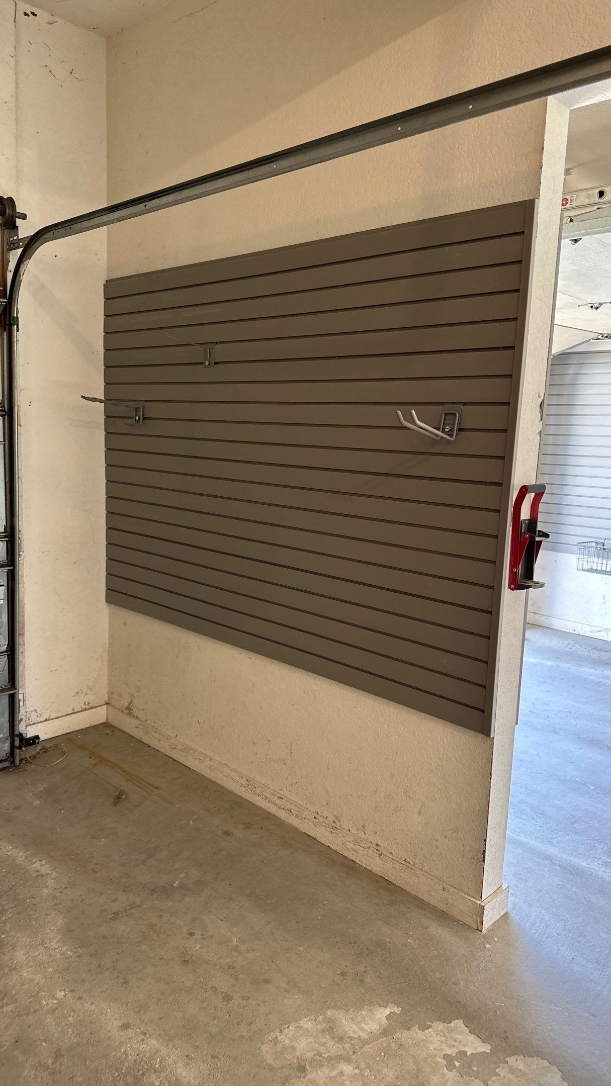 Melissa L. upgraded her garage with slatwall and overhead racks by Banner Garage