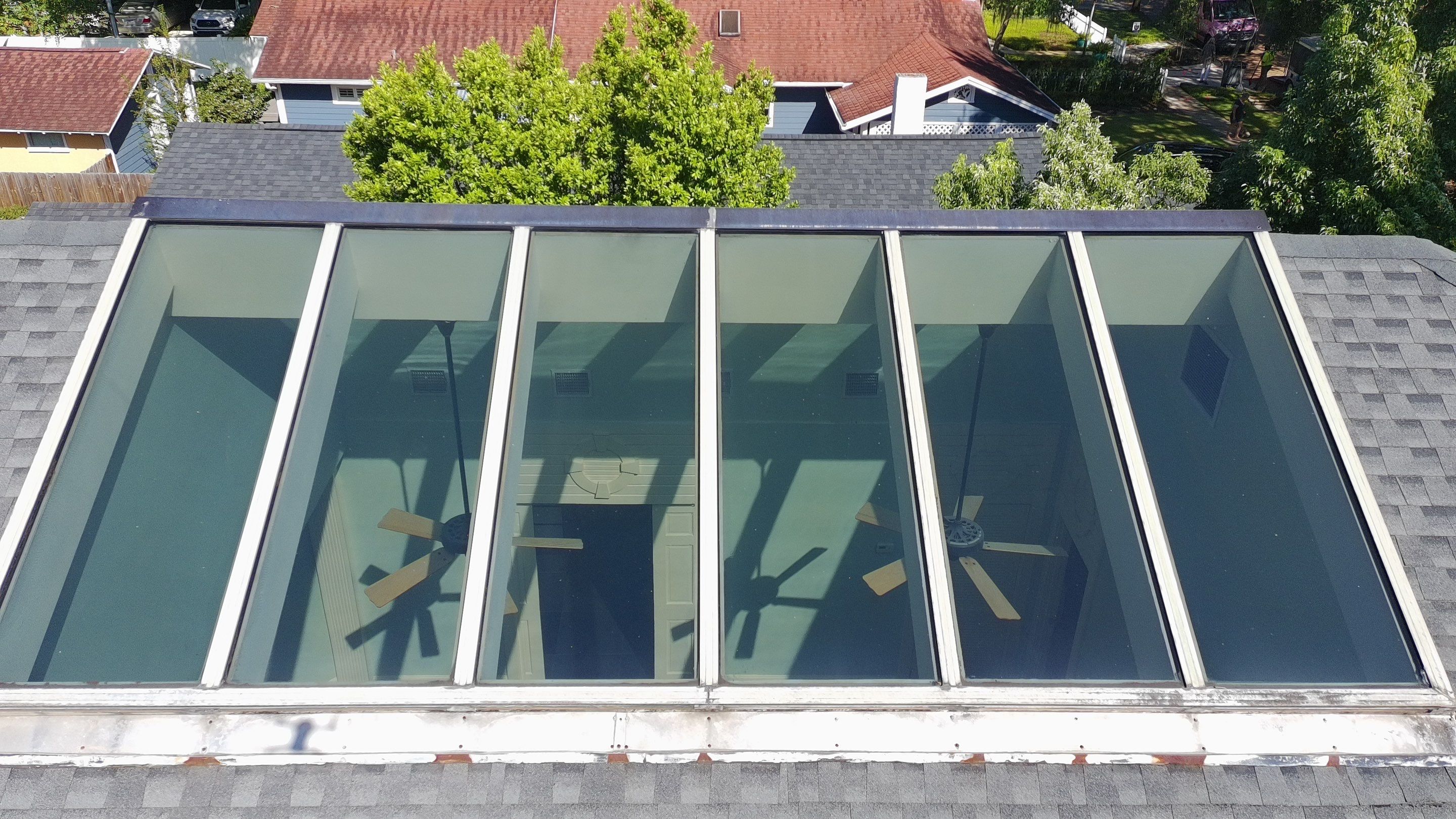 Ridge Skylight Repair and Shingle Roof Maintenance in Winter Park by Fortified Roofing Solutions Corp.