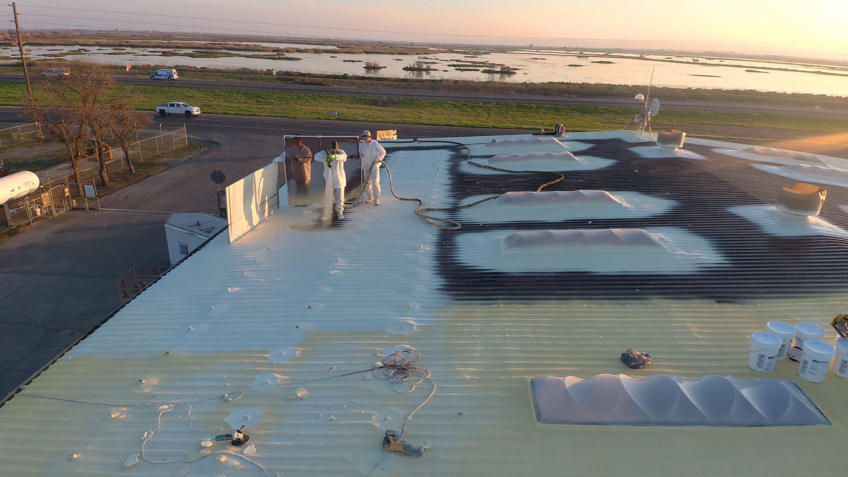 Metal roof restoration on commercial roof using Conklin Benchmark/ PUMA XL acrylic coatings over metal and foam by Straight Edge Roofing Inc