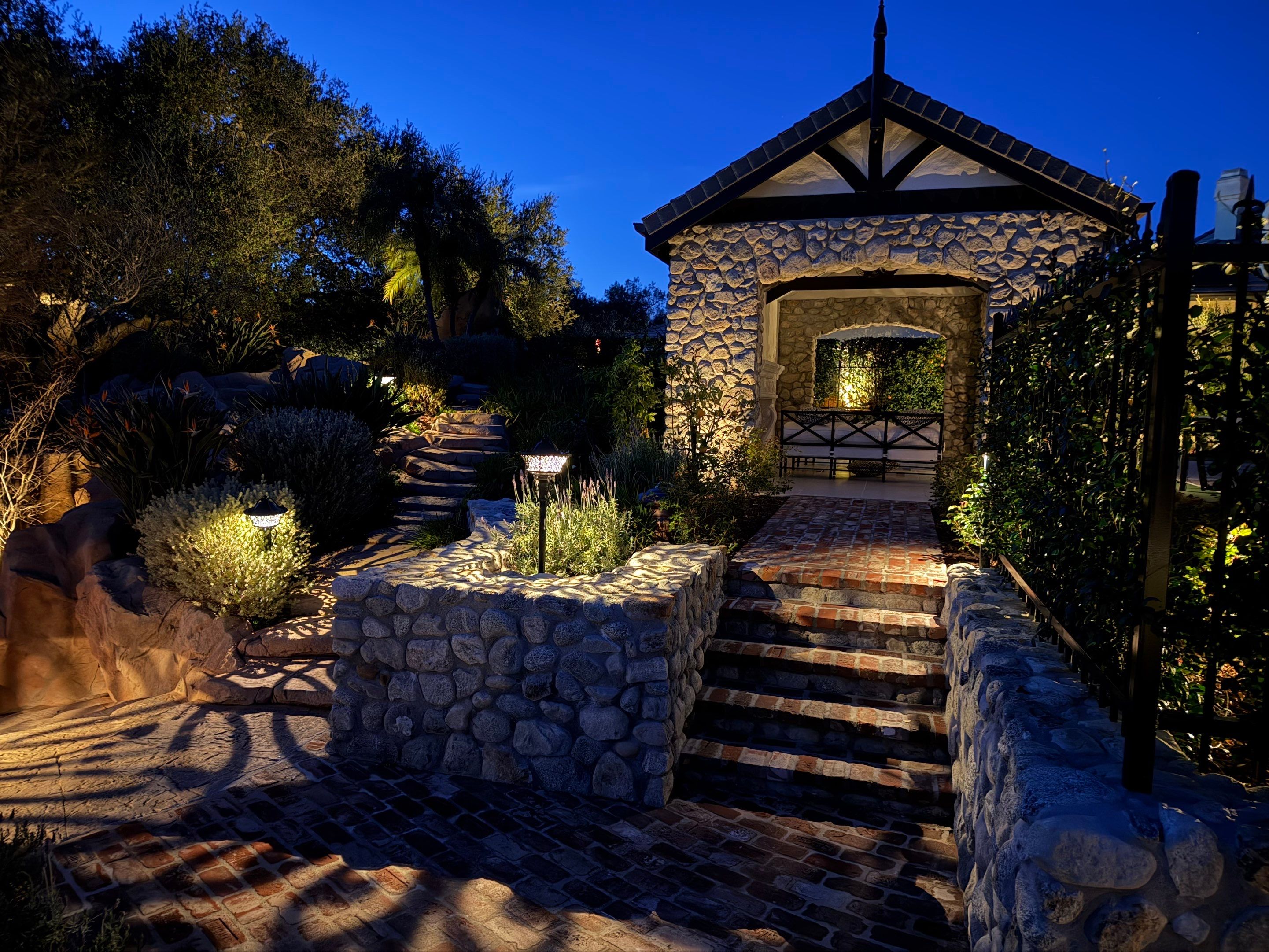 Tudor Estate Landscape Lighting with Integrated Stone Step Illumination by Outdoor Lights + Shades