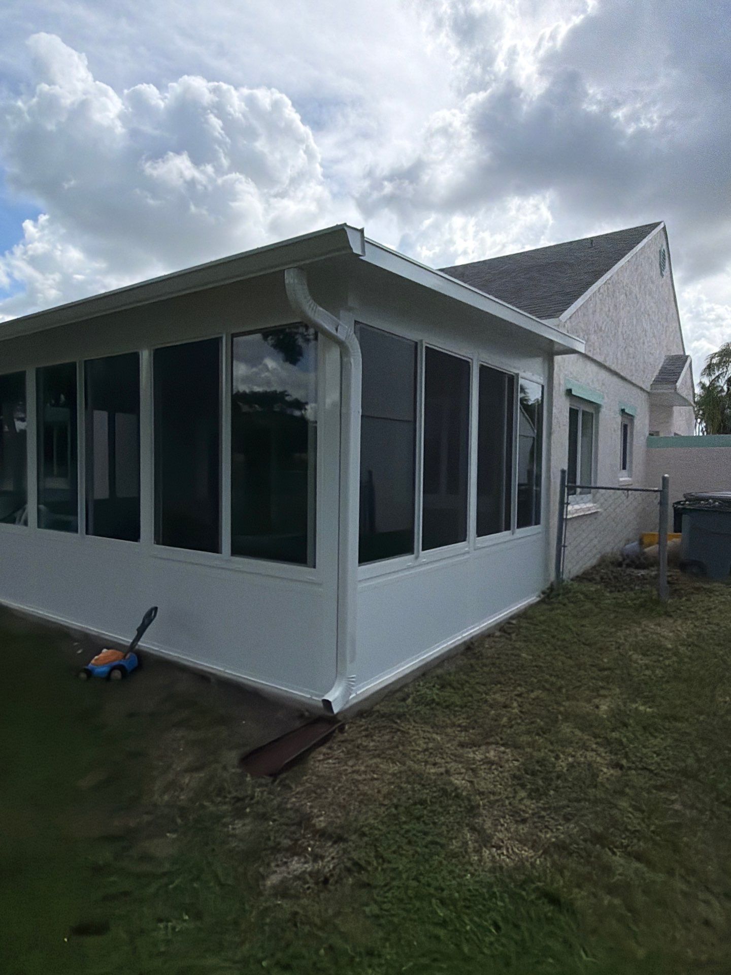 Custom Impact Sunroom With PGT Windows & Aluminum Insulated Roof in Boynton Beach by The Screen Depot, Inc