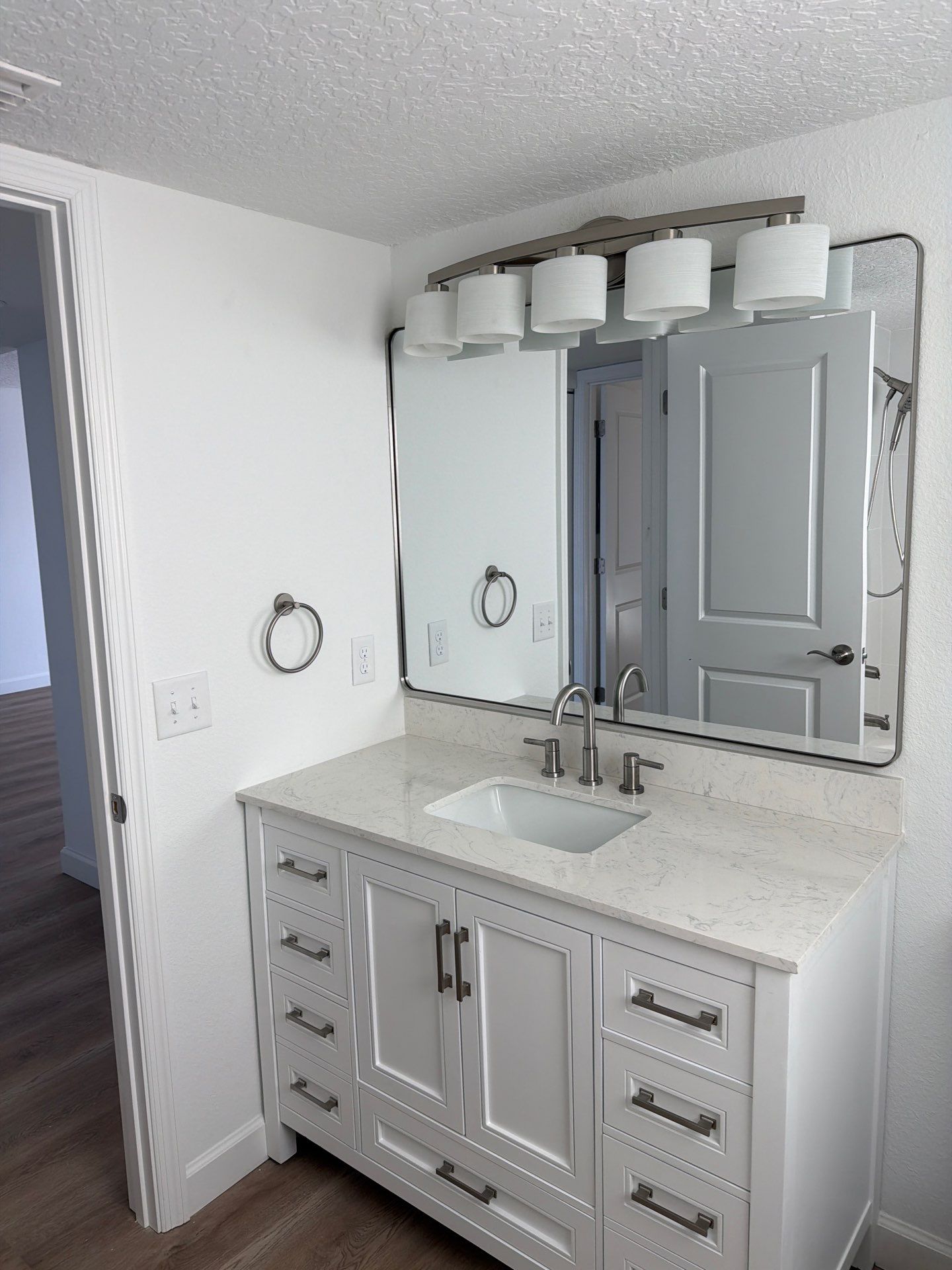 Full Condominium Remodel Featuring Aubrey Oak Flooring In Daytona Beach by Acies Renovations